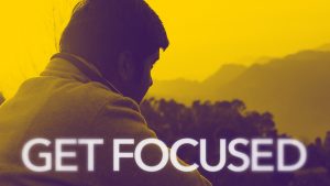 Get Focused graphic man in forefront