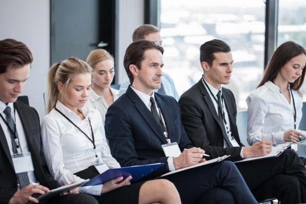 Business people at a conference learning