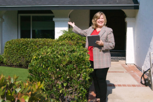 Smiling real estate agent just sold another house