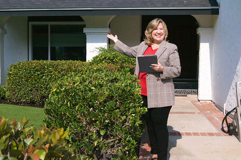 Smiling real estate agent just sold another house