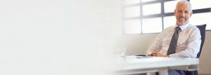 Man smiling at desk