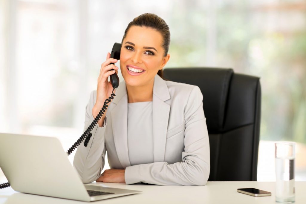 business woman on phone smiling