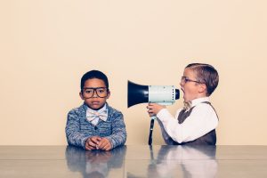 Young Boy Nerd Yells Through Megaphone Kid with megaphone talking to other kid