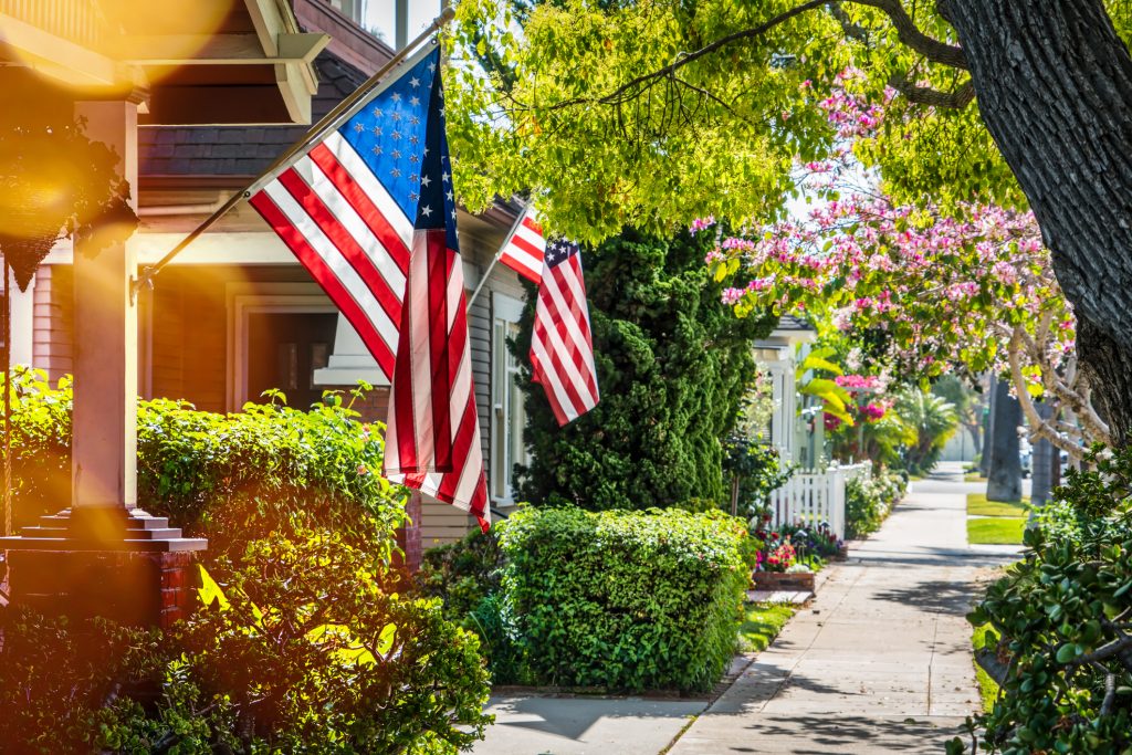 Flags hanging in beautiful neighborhood