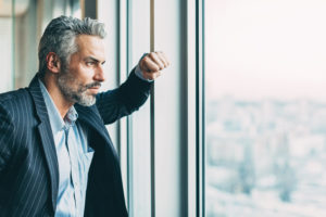 businessman looking out window