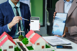 Two men use a predictive analytics platform to identify the value of homes in a neighborhood