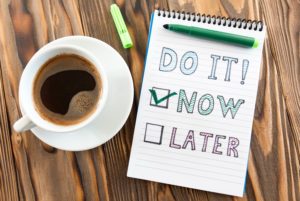 shutterstock_563267344 Do it now image next to coffee mug