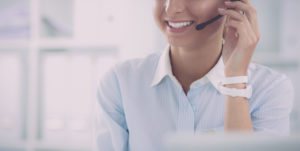 Customer service woman with headset smiling
