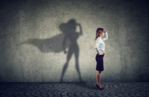 shutterstock_1114736909 Business woman with hero shadow