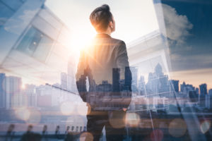 shutterstock_769705507 Businessman looking out window
