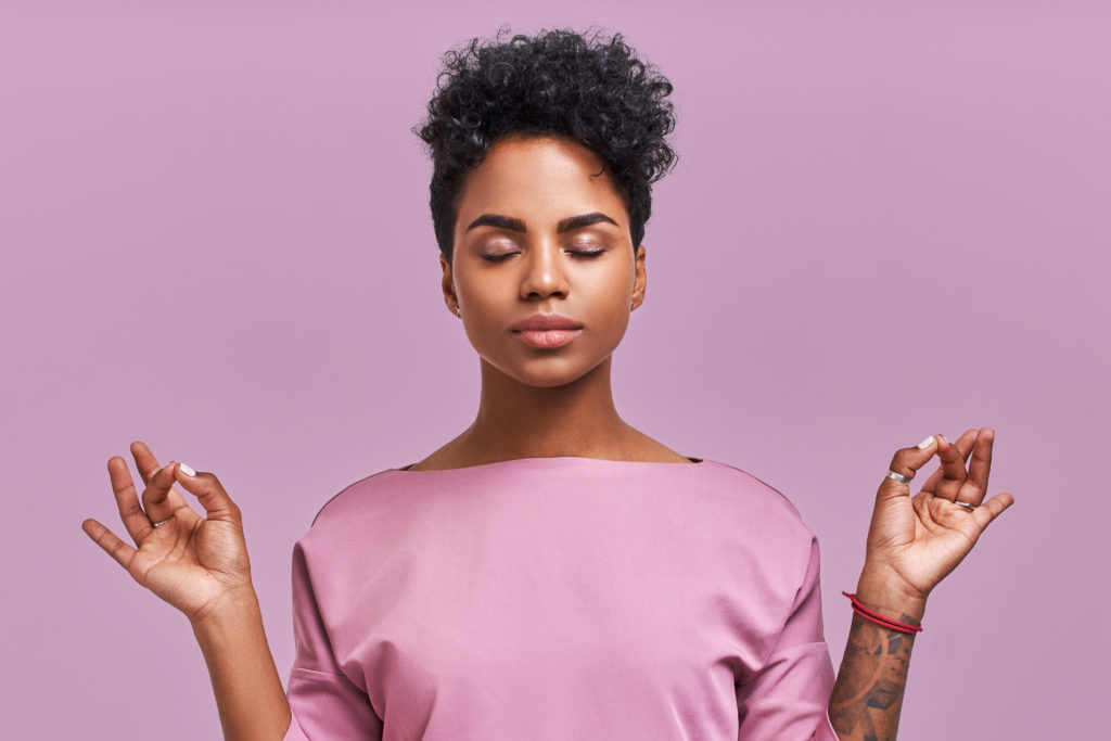 woman meditating in lavender