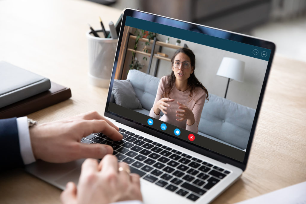 computer screen zoom call with woman in glasses