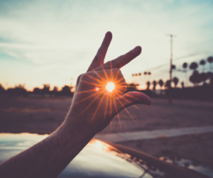 Sun beam seen through hand