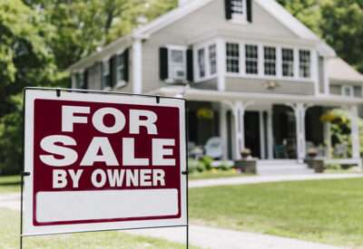 White house for sale by owner sign