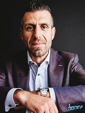 Headshot of man in watch