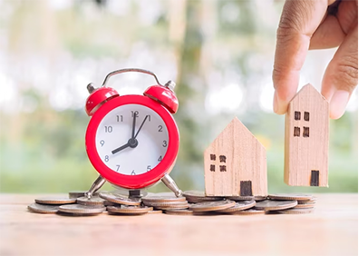 Image of clock with small wooden houses